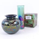 An Isle of Wight iridescent glass tubular vase, an iridescent glass bulbous vase, and a solid