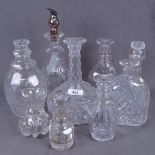 A quantity of various cut-glass decanters, largest height 21cm (9)