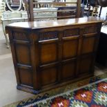 An oak canted-corner bar with carved panels, L157cm, H100cm, D38cm