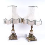 A pair of embossed brass table lamps and shades, 47cm overall