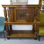 A light oak court cupboard, in 17th century style, with panelled door and allover relief carved