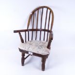 A 19th century child's elm seat stick-back Windsor chair, height 57cm