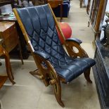 An Anglo-Indian campaign chair with leather sling seat, in the manner of Herbert McNair