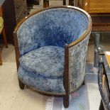 A 1920s French Art Deco tub chair, in the manner of Paul Follot, the oak frame with fluted front