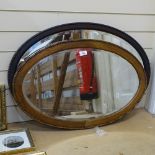 2 carved wood-framed oval bevel-edge wall mirrors, largest overall length 83cm (2)