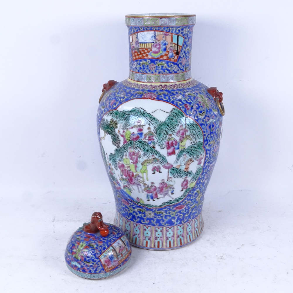A Chinese porcelain jar and cover, with decorated panels on enamelled blue ground, height 53cm - Image 2 of 2