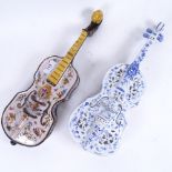 2 ceramic painted violins, length 39cm