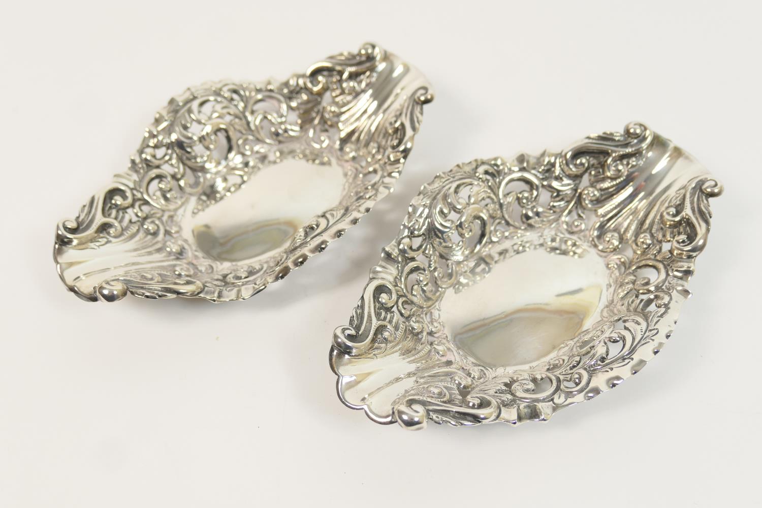 Pair of late Victorian silver bonbon dishes, London 1896, boat shaped, pierced and repousse