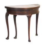 Early George III mahogany demi-lune tea table, circa 1760, the folding top supported on a swing