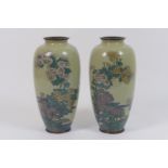 Pair of Japanese cloisonne vases, early 20th Century, ovoid form decorated with mountain flowers