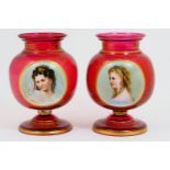 Pair of Victorian hand decorated ruby glass vases, circa 1870, footed bulbous form decorated with