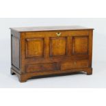 George III oak mule chest, circa 1780, the plank top opening to a candle box interior, with a