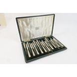 George V set of ten silver dessert knives and forks, London 1914, the handles worked with trailing
