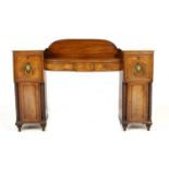 Regency mahogany twin pedestal sideboard, circa 1815-25, having a central bow front fitted with