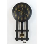 George V oak missionary clock, circular dial with Arabic numerals, the movement striking on a