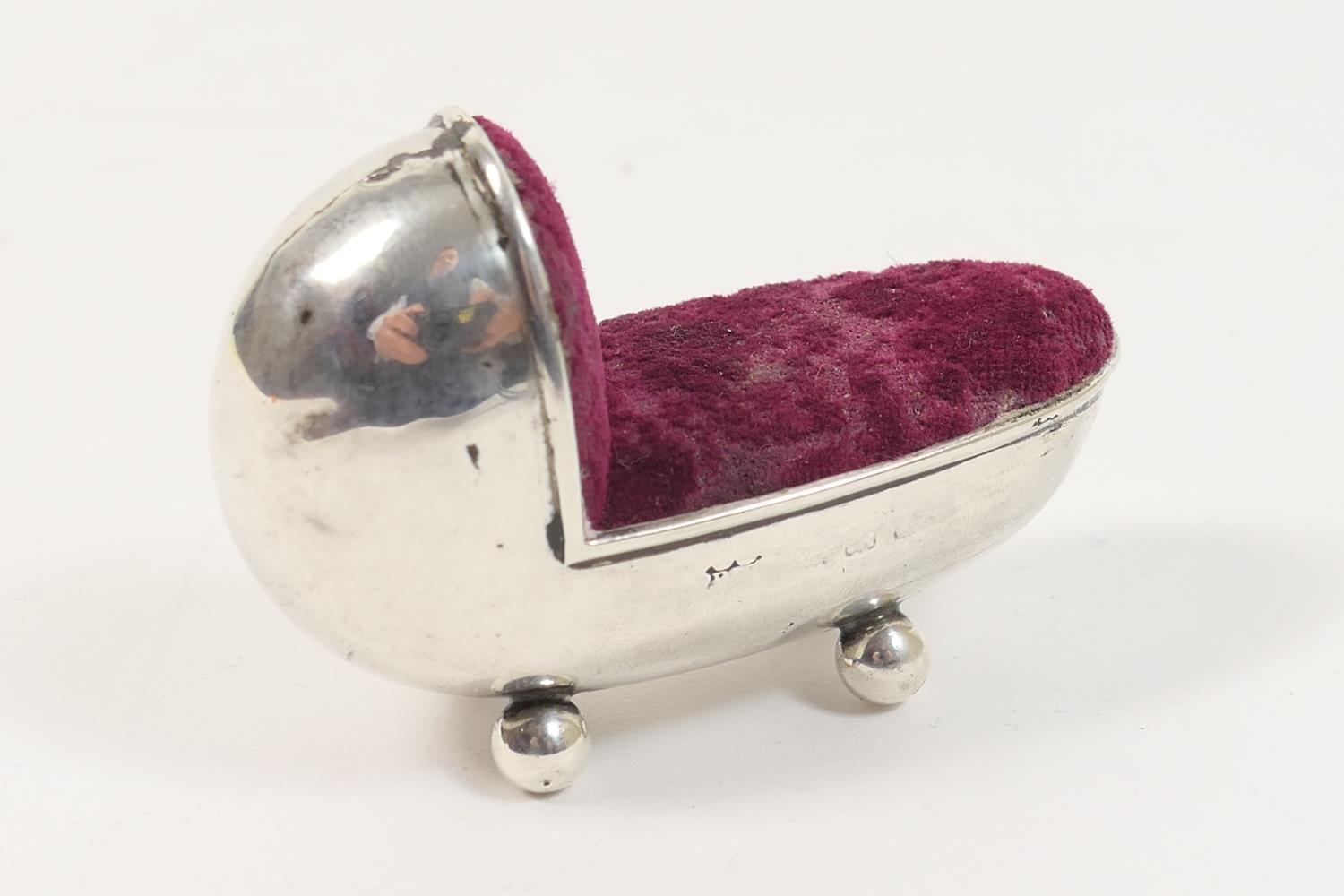 Unusual silver cradle form pin cushion, marks rubbed, 6cm