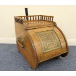 Late Victorian oak coal scuttle, circa 1890, with a bobbin turned galleried top, folding oak and