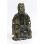 Carved spinach green soapstone figure of Gaunyin with a child, 19th Century or earlier, 15cm