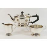 Silver three piece presentation tea service, London 1936, comprising lidded teapot, sugar basin