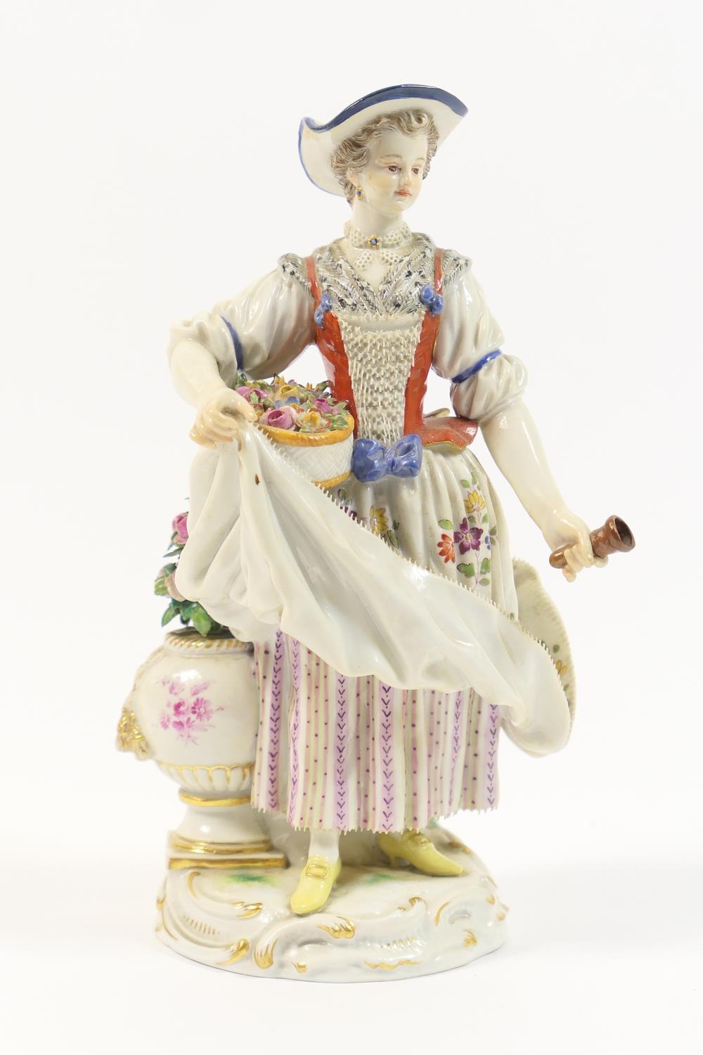 Meissen porcelain figure of a gardener, modelled holding a basket of flowers and with partial posy