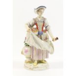 Meissen porcelain figure of a gardener, modelled holding a basket of flowers and with partial posy
