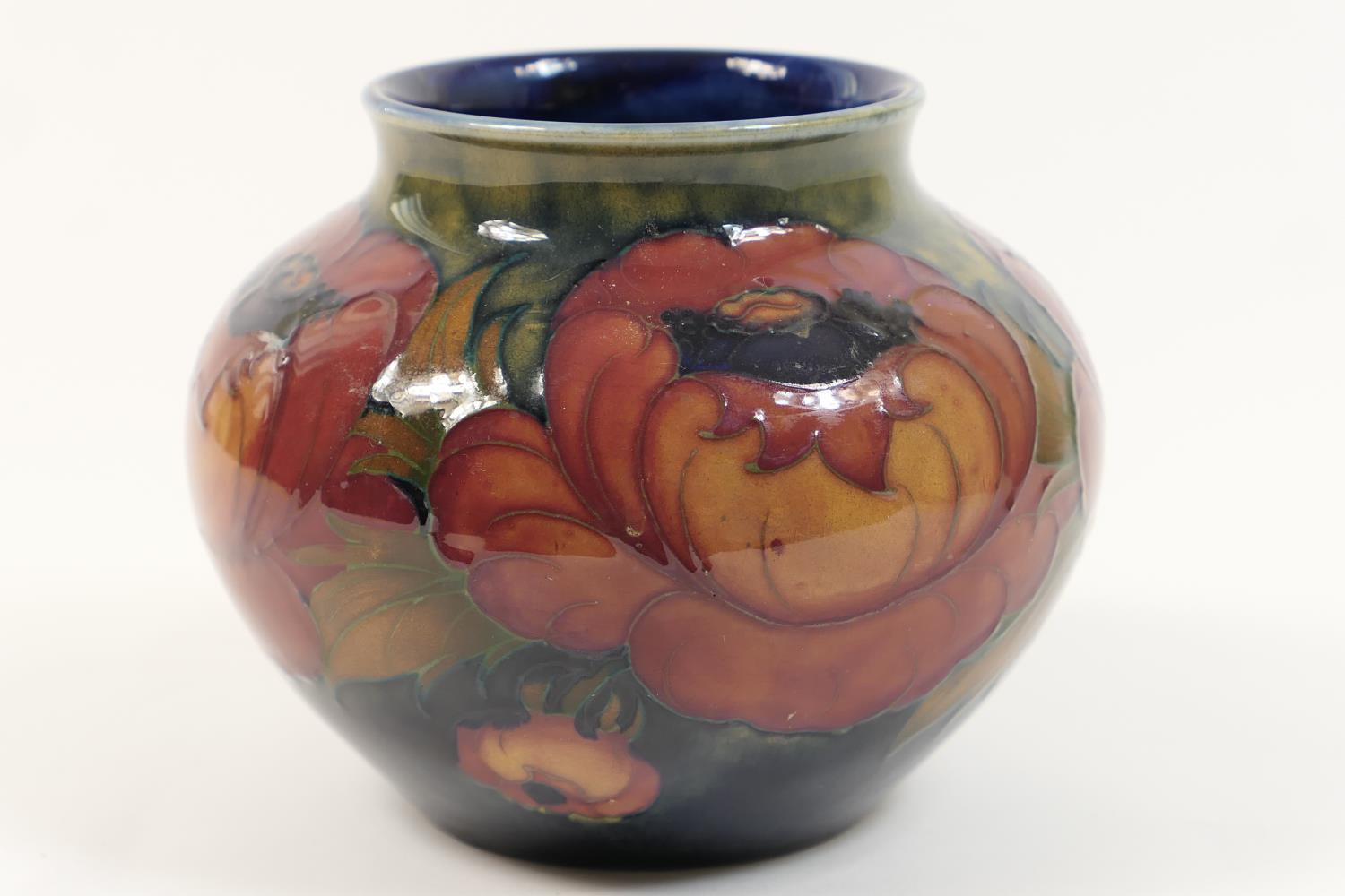 William Moorcroft Anemone vase, baluster form with wide neck, decorated with flowers in flambe