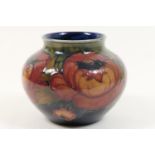 William Moorcroft Anemone vase, baluster form with wide neck, decorated with flowers in flambe