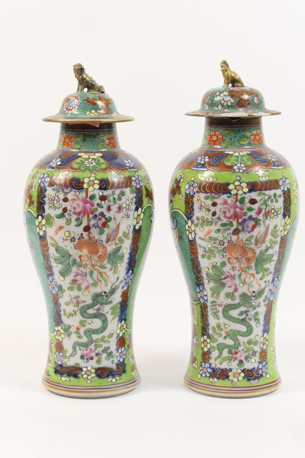 Pair of Chinese 'clobbered' export vases, early 19th Century with later decoration, each with a