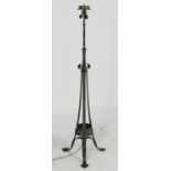 Arts and Crafts period wrought metal extendable standard lamp, circa 1905, with a three bulb fitting