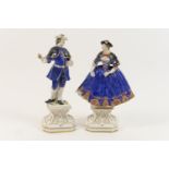 Pair of French porcelain figures, modelled as a gallant and his companion, glazed in colours over