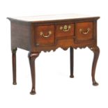 George III oak lowboy, circa 1760-80, the top with a moulded edge over three short drawers with