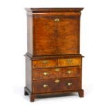 Queen Anne walnut secretaire, circa 1710, the secretaire top having an ovolu fronted long drawer