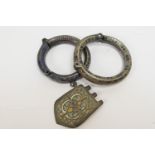 Two Byzantine or Medieval bronze enamelled bracelets, each having a hinged section, similarly
