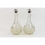 Two George V silver mounted cut glass onion decanters, by Walker & Hall, Sheffield 1925/26, both