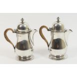 Pair of George V silver hot water jugs, London 1920, each in Queen Anne style, plain baluster form