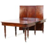 Good George IV mahogany extending dining table, circa 1825, the rectangular top with rounded corners