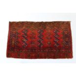 Turkmen Ensi woollen rug, having three rows of botehs against a madder field, size approx. 183cm x