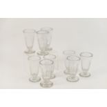 Nine cut glass jelly glasses, early 19th Century, with half faceted deep bowls over a facet edged