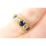 Edwardian sapphire and diamond ring, Birmingham 1908, having three oval cut sapphires dispersed with