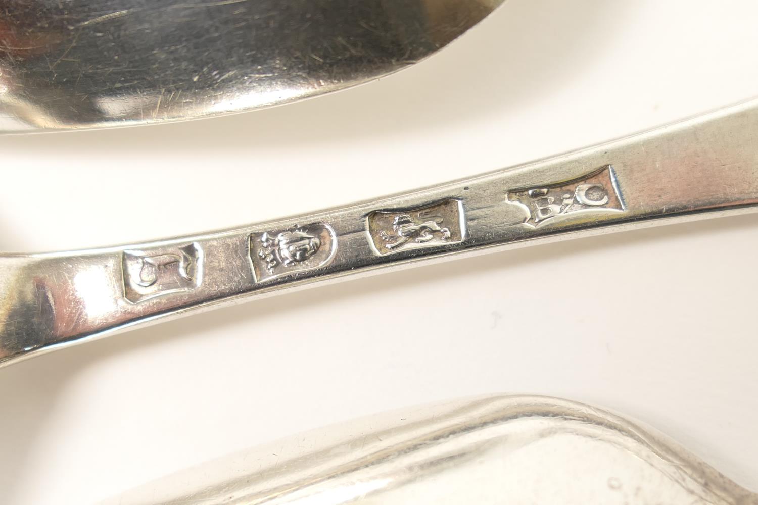 Pair of George III silver tablespoons, maker B.C., London 1766, also a Queen Anne silver rat tail - Image 3 of 3