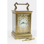 French brass carriage clock, circa 1930, the brass embellished cream dial with Arabic numerals,