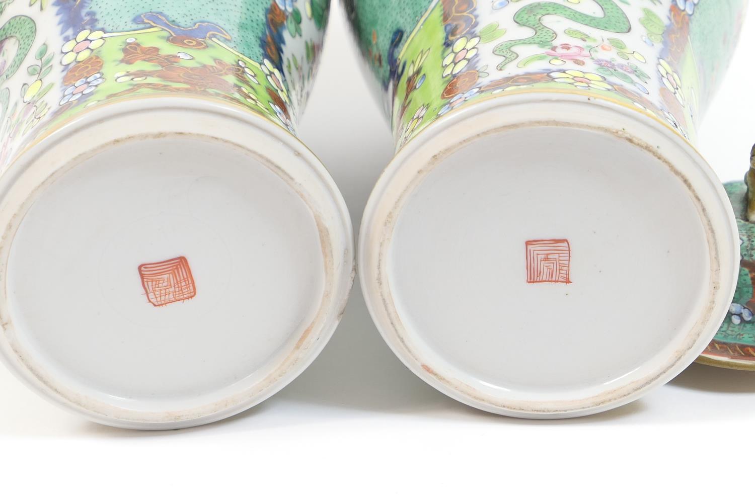 Pair of Chinese 'clobbered' export vases, early 19th Century with later decoration, each with a - Image 8 of 18