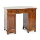 Mahogany kneehole dressing table, in the manner of Gillows, early 19th Century, fitted with three