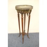 French ormolu and walnut jardiniere stand, late 19th Century, having an octagonal marble top with