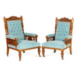 Pair of Victorian carved oak gentleman's and lady's armchairs, circa 1870, having shell carved