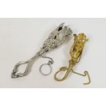 Two decorative posy holders, one being silver plated and worked with vine leaves and wheat ears,
