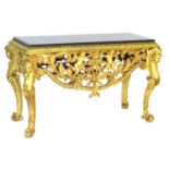 Italian style gilt metal console table, black granite top over a border of stiff acanthus leaves and