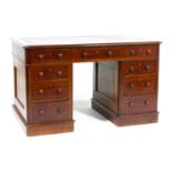 Victorian mahogany twin pedestal desk, having a tooled red leather top within a moulded edge, raised