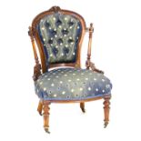 Victorian walnut and upholstered lady's salon chair, having blue satin deep buttoned spoon back,