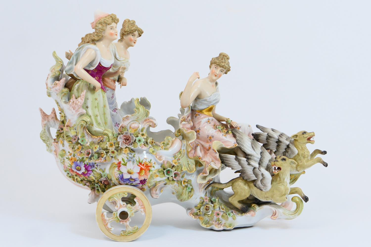 Sitzendorf porcelain table centre, circa 1900, modelled as a mythical chariot supporting three